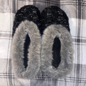 black and grey furry slippers